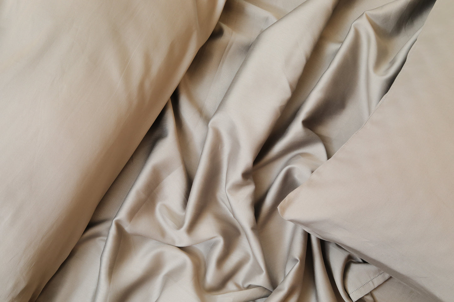Close-up of dark grey bed sheets set fabric and pillow cover