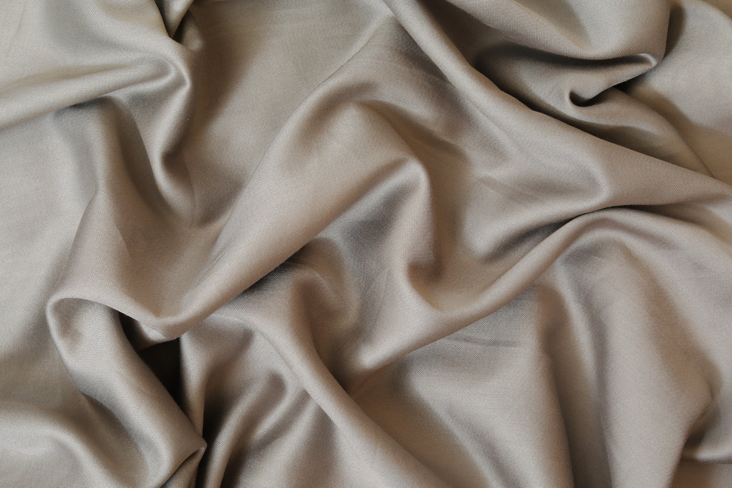Close-up of dark grey fitted sheet smooth cotton fabric