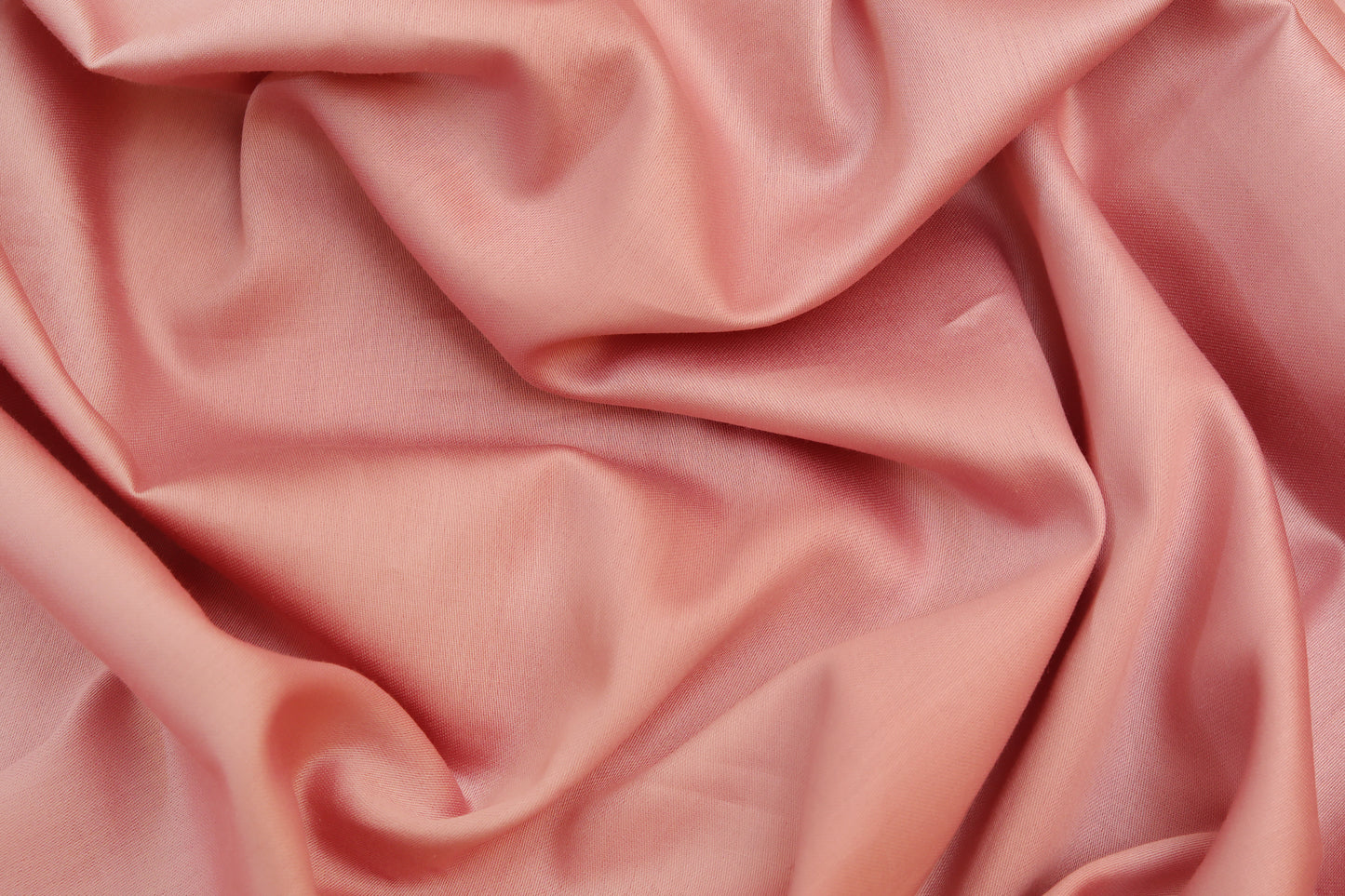 Smooth fabric texture of pink bed sheets set with folds