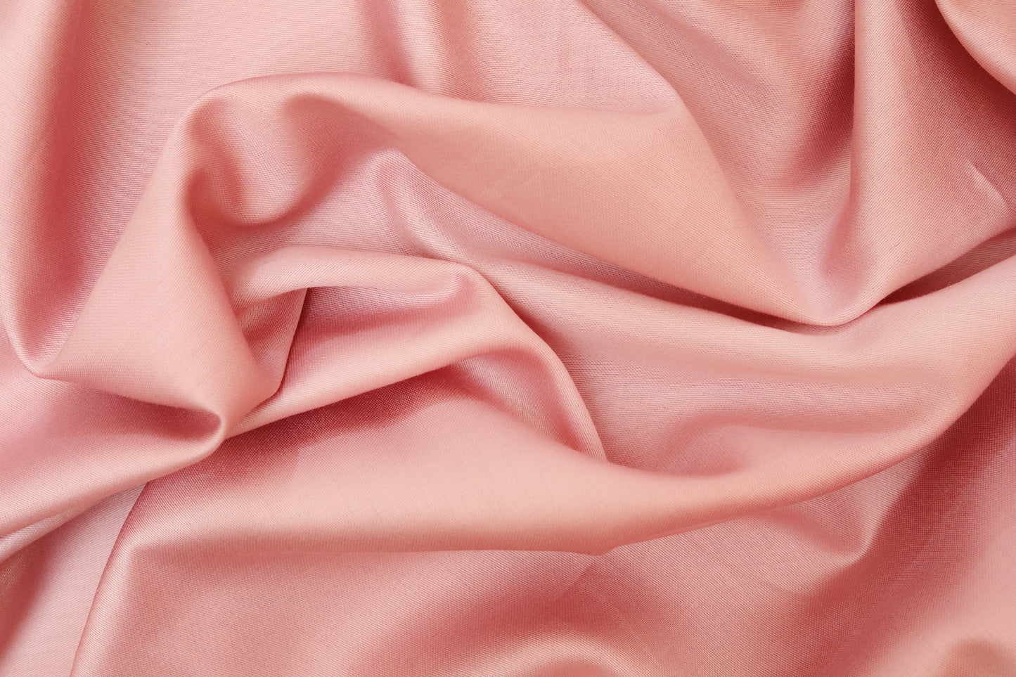 Close-up of pink fitted sheet soft fabric texture