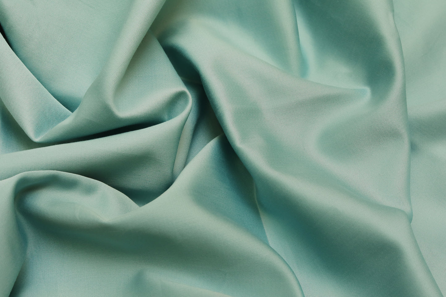 Close-up of sky blue fitted sheet soft cotton fabric