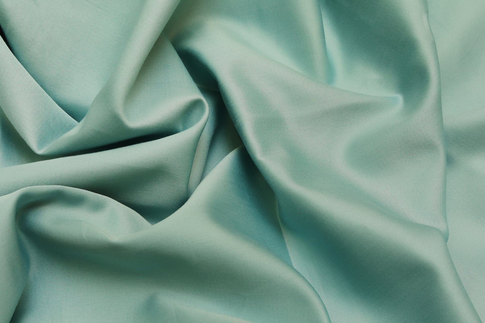 Close-up of sea green quilt cover fabric texture