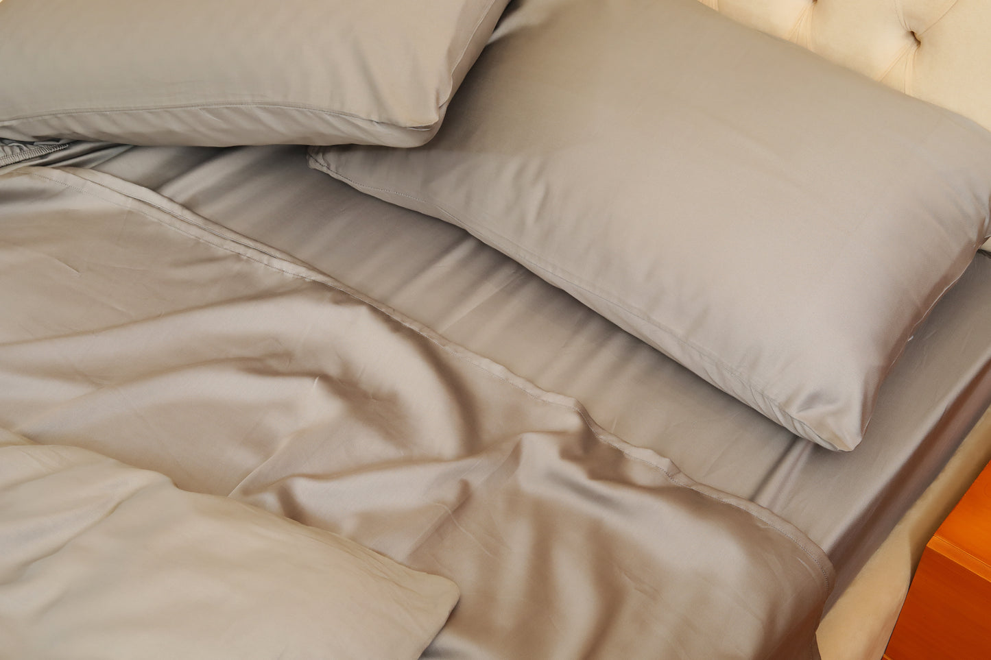 Close-up of dark grey quilt cover set with smooth fabric finish