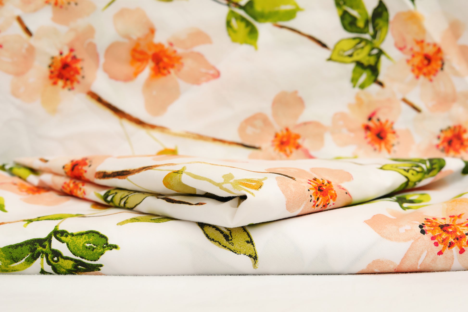 Close-up of floral printed cotton percale quilt cover fabric