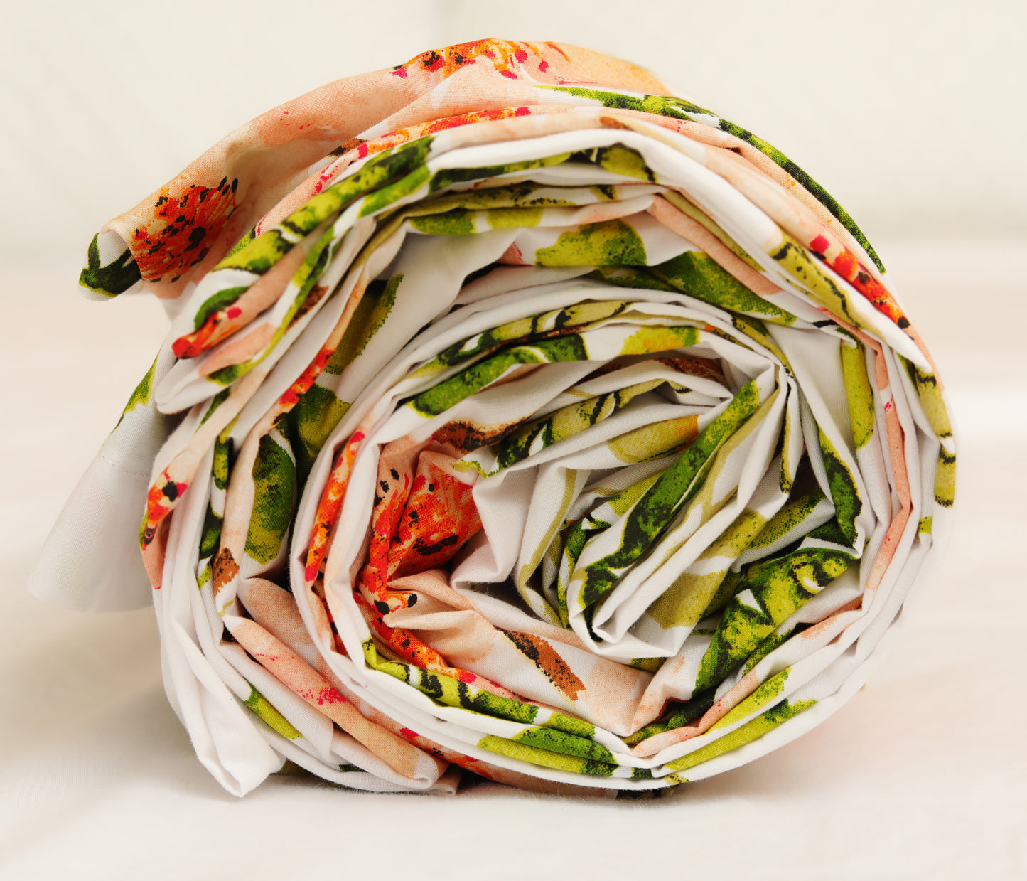 Printed cotton percale quilt cover neatly rolled for packaging