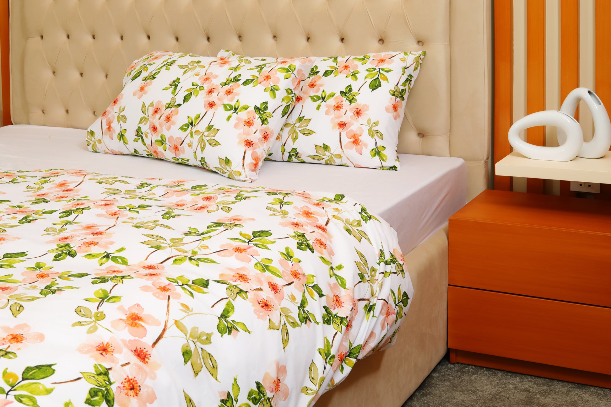 Printed cotton percale quilt cover set with matching pillowcases on bed